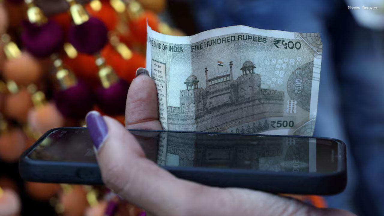 Indian Rupee Dips Amid Surge in Corporate Dollar Demand Despite Fed Rate Cuts